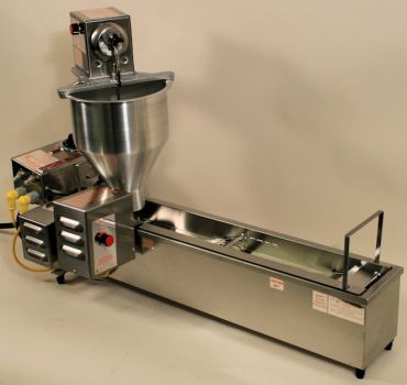 Industrial stainless steel machine with funnel and conveyor for food processing.