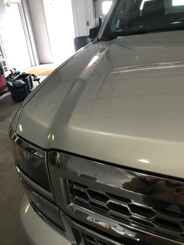 After photo of a big dent repair on a chevy hood.