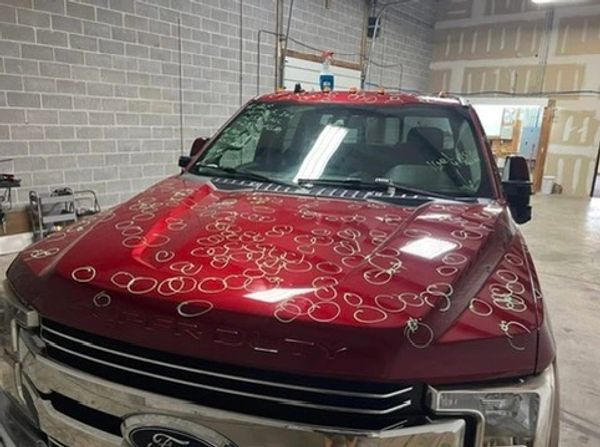 Circles on truck for Hail Damage insurance approval