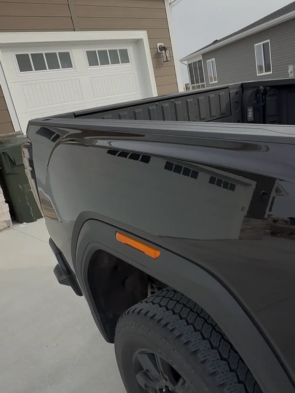 After Photo Of Paintless Dent Repair. Black 2024 GMC Sierra AT4.