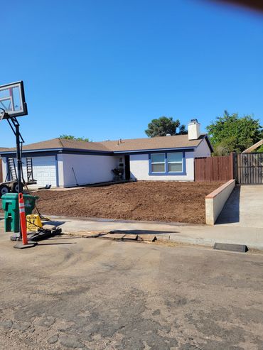 After removing ten yards of soil and wall, bring in twelve yards of mulch