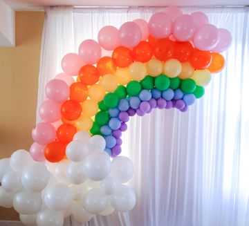 rainbow balloon garland for pride month and st patrick's day decor. care bare decor