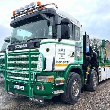 Scania 124L with three drum carriers loaded on body.
