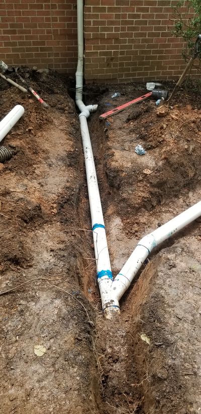 Gutter Downspout extension underground pipe installation | French drain install. Maryland landscaper