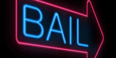 Neon sign with the word 'BAIL' and an arrow.