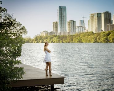 Senior photo on Austin waterfront with natural, candid style.