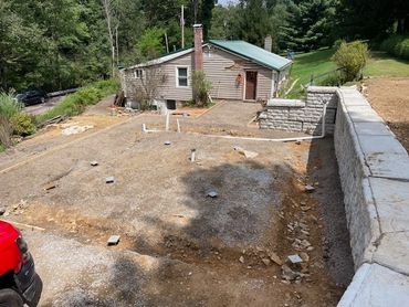 New Construction Brackets Poured in the concrete foot and slab of a garage build