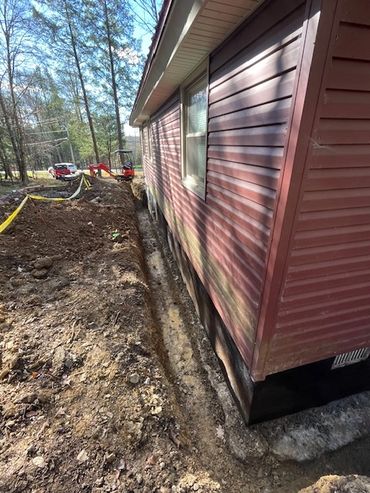 Install of a footer drain and dimple board for waterproofing