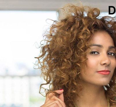 Deva Curl curly hair holding hair