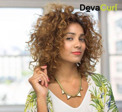 Deva Curl curly hair holding hair