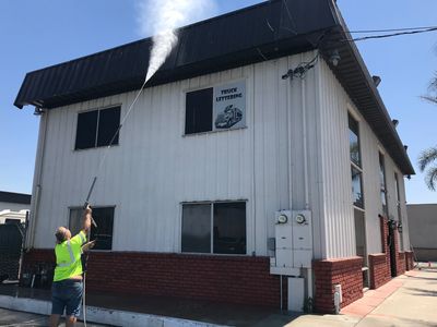 Washing down a commercial office building.