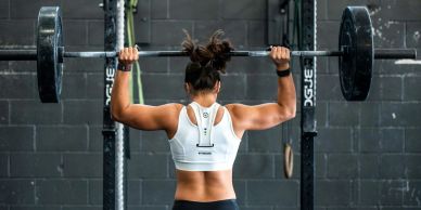 Woman lifting weights during a fitness workout at a gym near St. Augustine Beach