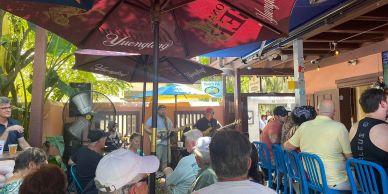 Guests enjoying live music, drinks, and a lively outdoor patio atmosphere at Pierre’s Pub in St. Aug