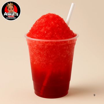 Bright red frozen slushie in a clear plastic cup with a white straw.