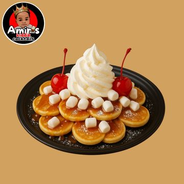 Mini pancakes topped with whipped cream, cherries, and marshmallows on a black plate.