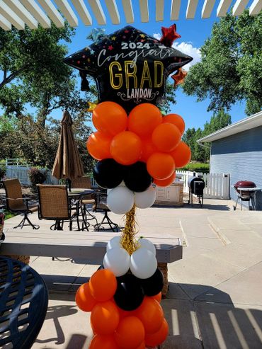 Congrats Graduation Balloon Column with colors matching the high school's colors! Grad Hat balloon.