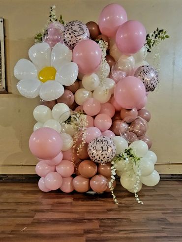 Flower themed balloon column to celebrate a happy birthday!