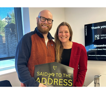happy buyer at real estate settlement table