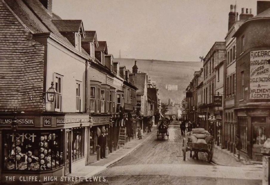 The High street in Lewes many years ago 
where the Antique dolls and antique bears shop is today. 