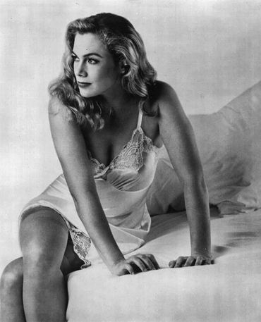 Kathleen Turner in a silky vintage slip