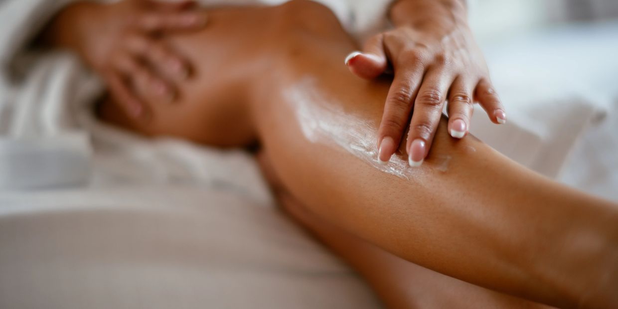 Woman apply tan extender at her home in Wyoming, Ohio near Cincinnati