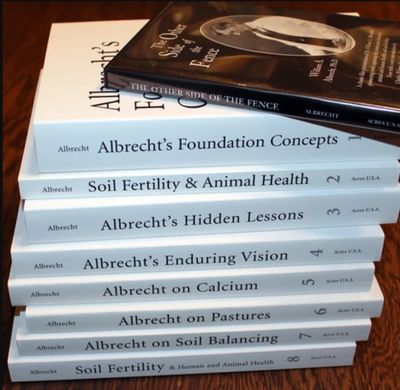 Stack of books by Dr. William Albrecht.