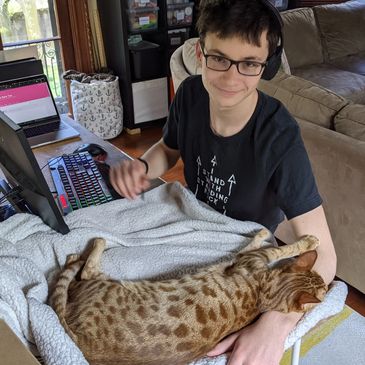 Isa making things with some help from Pangur