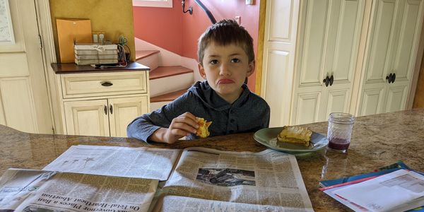 Levi reading the Wall Street Journal