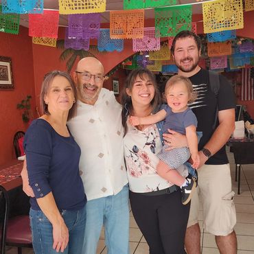 Joe's wife and daughter with her husband and grandchild.