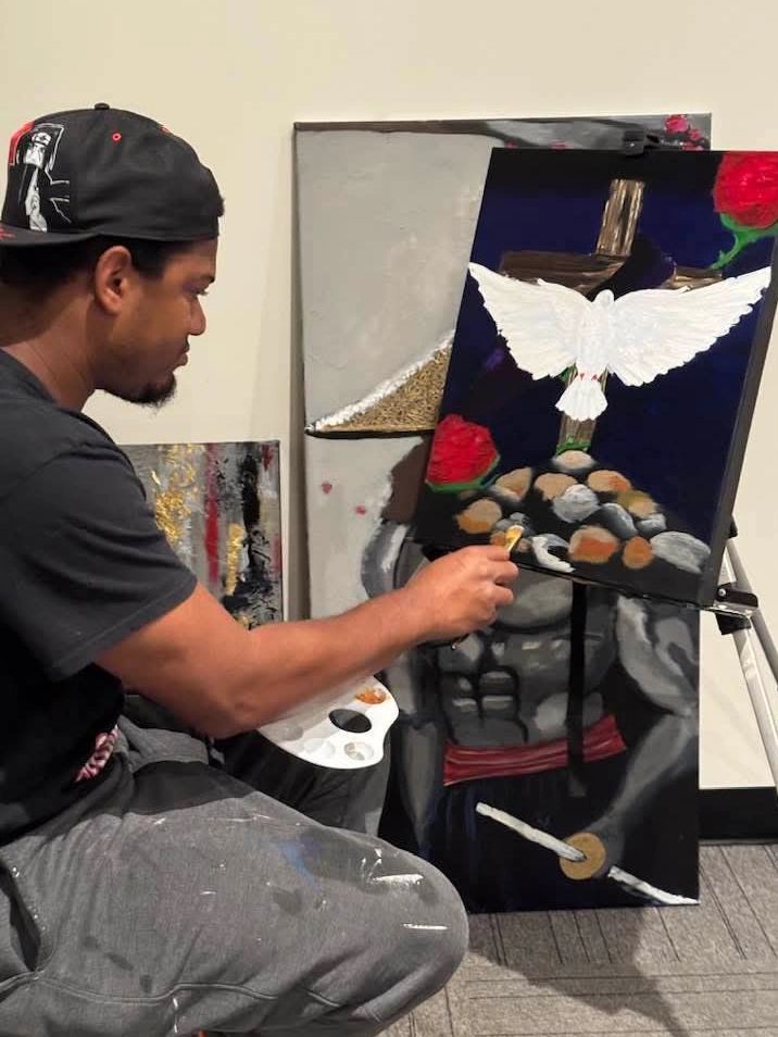 Lavonous painting a commissioned piece of artwork.