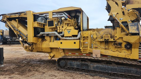 Large yellow industrial track grinder.