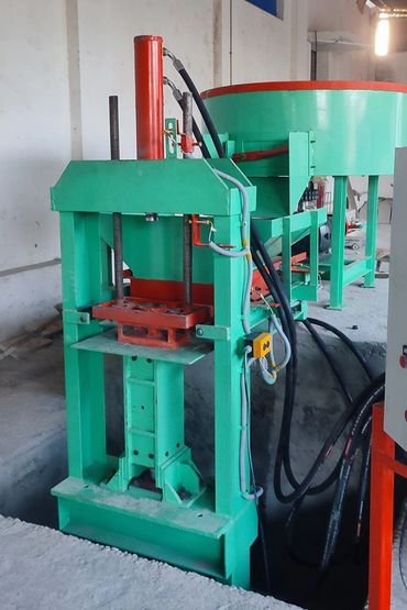 Interlocking brick making machine