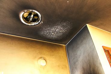 Residential home with fire damage on the ceiling.