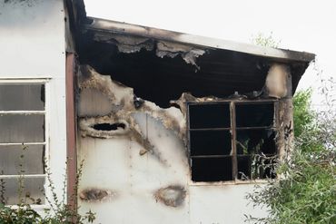 Fire damage in the back of the home on the side porch.