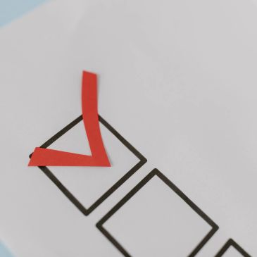 Checklist box checked with red tape.