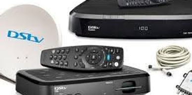 DSTV satellite decoder with remote and accessories.