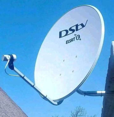 DSI satellite dish under clear sky.