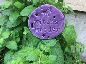 Round Ceramic garden sign , Embossed with dragonfly with cut out moon and stars. A delightful additi