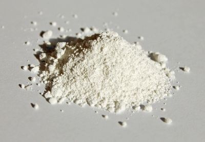 Pile of white powder on a gray surface.