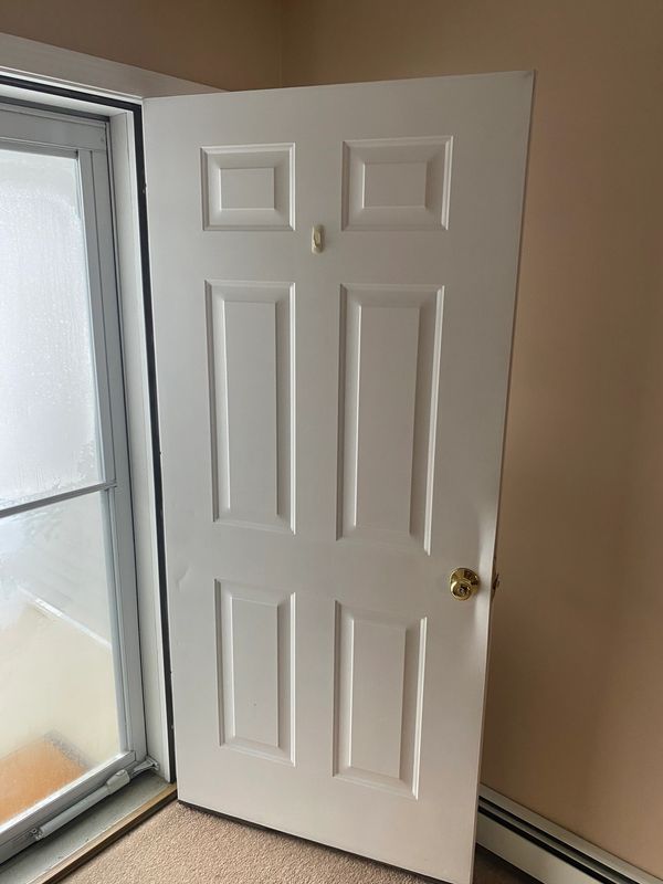 This door was replaced after taking damage during entry.
