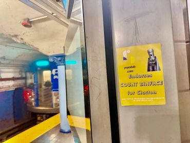 Sticker announcing a contest for Clayton on a subway platform.