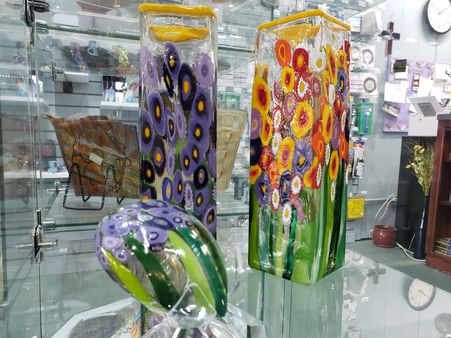 Brazos Glassworks features art glass from "Mad Art Glass" - handmade glass vases in bright colors.