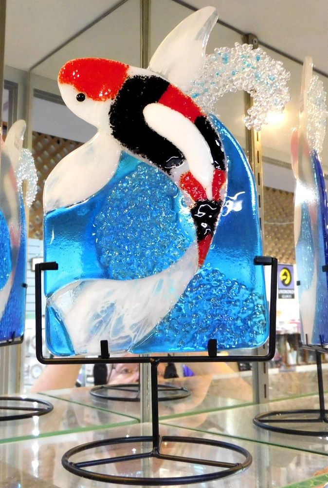 Beautiful fused glass Koi are displayed in a perfect metal frame. Take a glass fusing class with us!