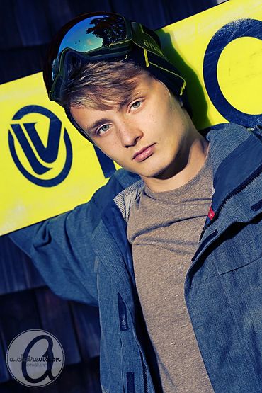 High school senior guy with his snowboard