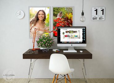 two framed portraits above student desk