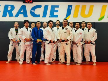 Group photo of adult Gracie Jiu Jitsu and Brazilian Jiu Jitsu practitioners last class of 2025