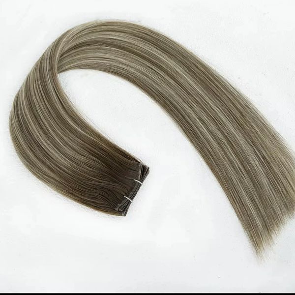 Smooth, straight hair extensions in a gradient of brown to ash blonde.