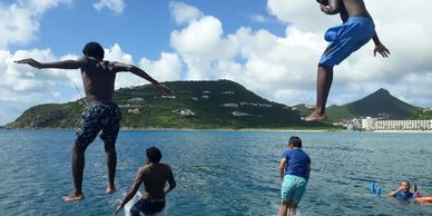 Jumping, diving, swimming of the boat. Great Bay swimming, Little Bay Swimming, Divi , tanning,  sun