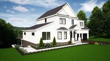 Modern white house with black windows and lush green landscaping.