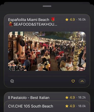 Outdoor dining at a lively Miami Beach seafood and steakhouse with string lights.